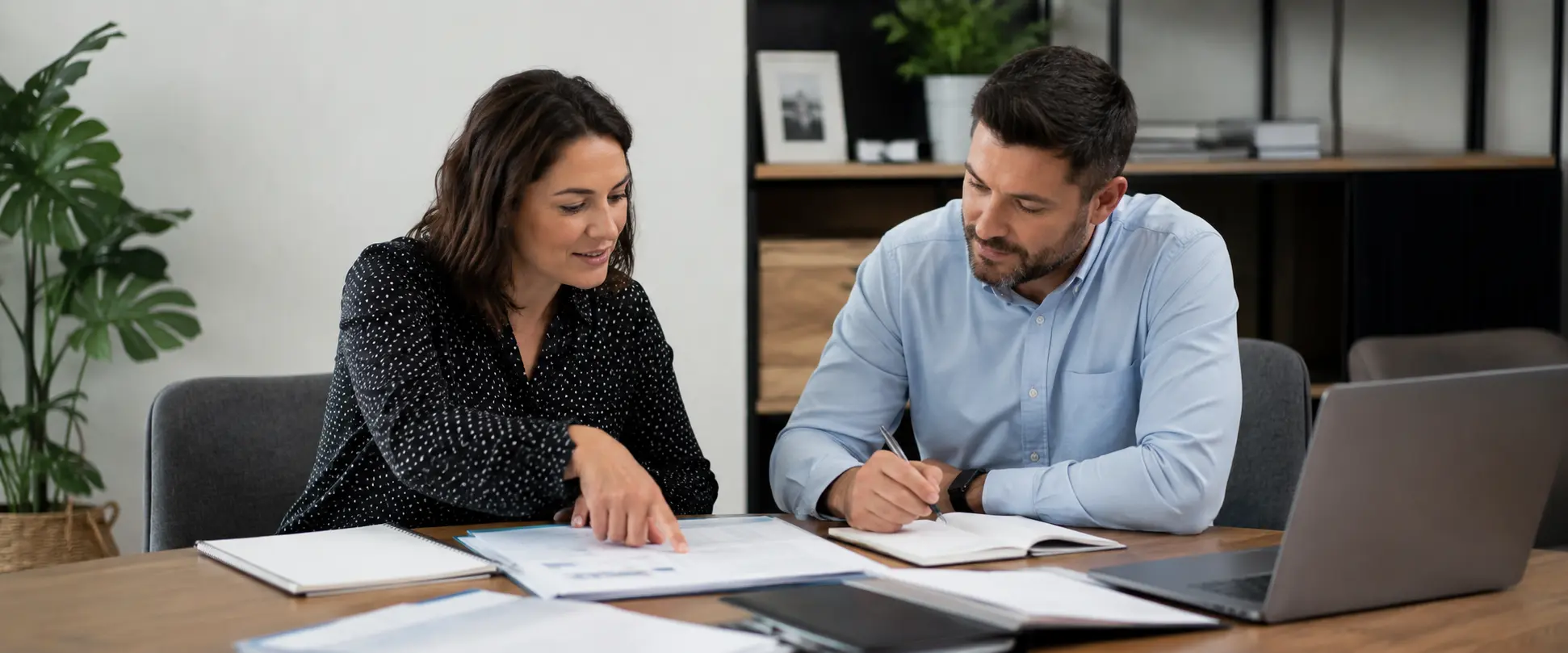 A consultant and SIL provider reviewing compliance documents together in preparation for an NDIS certification audit